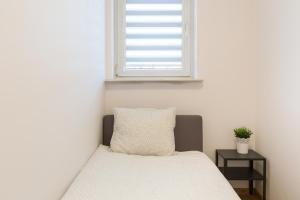 Posteľ alebo postele v izbe v ubytovaní Wodna Street Big Family Apartment