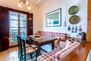 a living room with a table and a couch at Villa Ponente in Spetses