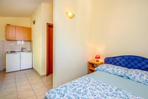 Postel nebo postele na pokoji v ubytování Apartments & Restaurant Galeb