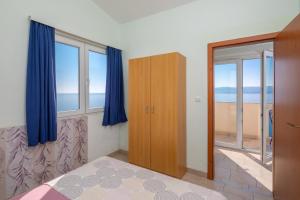 Postel nebo postele na pokoji v ubytování Apartments & Restaurant Galeb