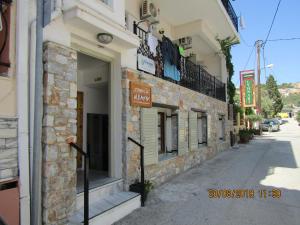 a building on the side of a street at ALKMENE STUDIOS in Skiathos