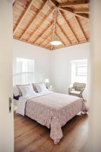 Tempat tidur dalam kamar di Villa Mariense