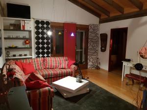 a living room with a couch and a table at Hotel Platten Apartment in Gersau