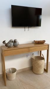 TV a/nebo společenská místnost v ubytování Cabaña Quinta Gaes Spa