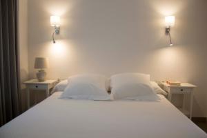 Llit o llits en una habitació de Apartamentos MadreSelva