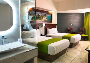 Postel nebo postele na pokoji v ubytování Hotel Lois Veracruz + 37 fotografií