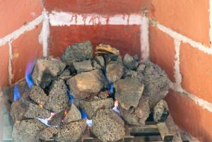 a pile of rocks on top of a brick fireplace at Hotel Parador del Cortijo Spa in San Miguel de Allende