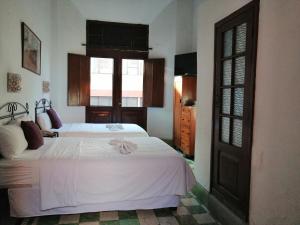 Postel nebo postele na pokoji v ubytování Hotel Reforma