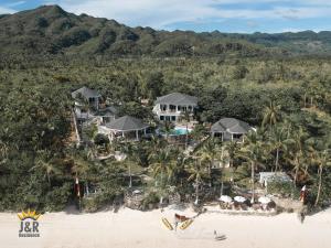 an aerial view of a resort on the beach at J&R Residence in Anda