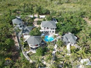 an aerial view of a house with a swimming pool at J&R Residence in Anda