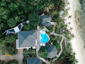 an aerial view of a resort with a pool at J&R Residence in Anda