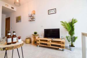 Televízia a/alebo spoločenská miestnosť v ubytovaní P&P Apartaments Carrera de Capuchinos
