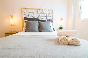 Posteľ alebo postele v izbe v ubytovaní P&P Apartaments Carrera de Capuchinos