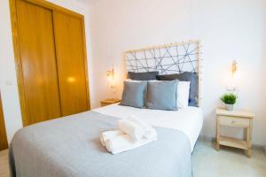Posteľ alebo postele v izbe v ubytovaní P&P Apartaments Carrera de Capuchinos