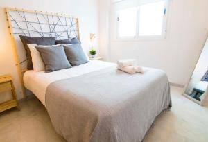 Posteľ alebo postele v izbe v ubytovaní P&P Apartaments Carrera de Capuchinos