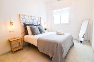 Posteľ alebo postele v izbe v ubytovaní P&P Apartaments Carrera de Capuchinos