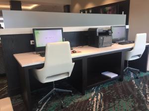 an office with a desk with two monitors and a printer at Holiday Inn Cincinnati North West Chester, an IHG Hotel in West Chester