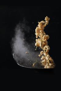 a pile of popcorn on top of a plate at The Landis Taipei in Taipei