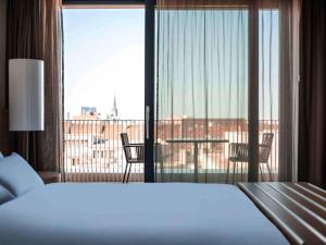 Łóżko lub łóżka w pokoju w obiekcie Pullman Basel Europe