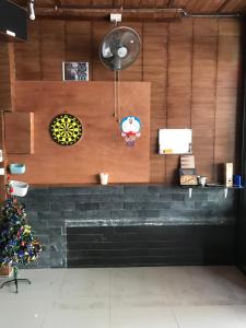 
a wooden wall with a clock on top of it at Secrets - Pattaya in Pattaya Central
