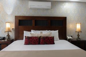 Postel nebo postele na pokoji v ubytování Colombe Hotel Boutique