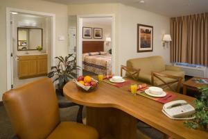 a room with a table with a bowl of fruit on it at Candlewood Suites Temple by IHG in Temple