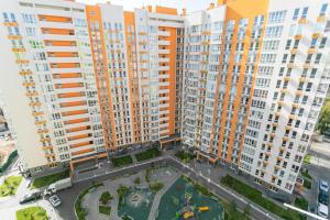 an overhead view of a large apartment complex with tall buildings at 13131 floor Nivki-park in Kyiv