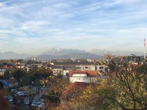 a view of a city with mountains in the background at BEA Active Studio near city center Tivoli Park in Ljubljana