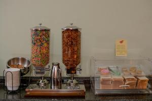 a counter top with two tall containers of cereal at DURAZNO INN in Nuevo Casas Grandes