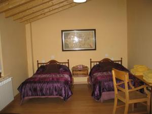 A bed or beds in a room at Casa Rural Duquesa De La Conquista de Ávila