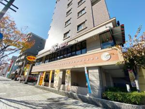 a building on the side of a street at OUCHI HOTEL Dambara in Hiroshima