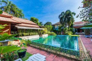 an image of a swimming pool in a house at Monaburi Boutique Resort in Rawai Beach