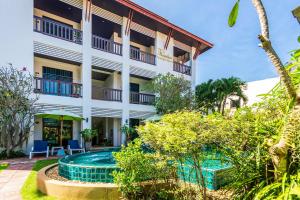 a view of the hotel from the garden at Monaburi Boutique Resort in Rawai Beach