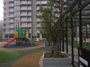 a playground in front of a apartment building at Avanie Suite at Genting Highland in Genting Highlands