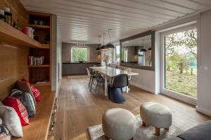 a kitchen and dining room with a table and chairs at Finest Ski Chalet Leogang by All in One Apartments in Leogang