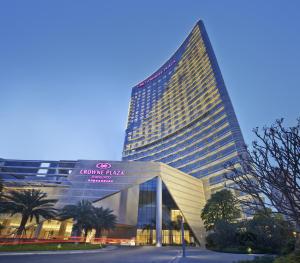 a large building with a sign in front of it at Crowne Plaza Zhangzhou, an IHG Hotel in Zhangzhou