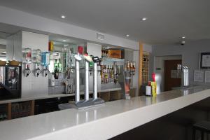 a bar in a restaurant with a counter top at Holiday Inn Express Nuneaton by IHG in Nuneaton