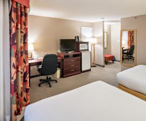 a hotel room with a bed and a desk at Holiday Inn Express Red Deer, an IHG Hotel in Red Deer