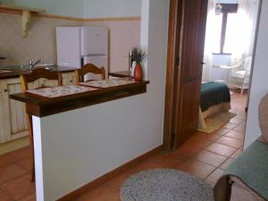 A kitchen or kitchenette at La Casa del Telar