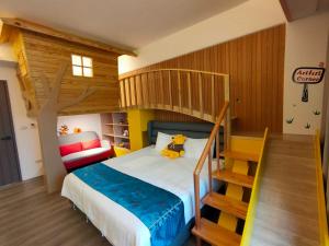 A bed or beds in a room at Wujie Childlike B&B