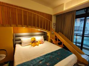Cama ou camas em um quarto em Wujie Childlike B&B