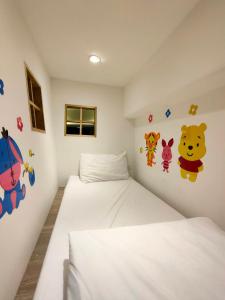 Cama ou camas em um quarto em Wujie Childlike B&B