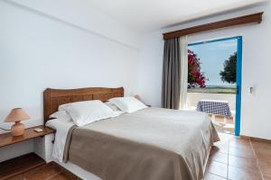 Voodi või voodid majutusasutuse Olympia Mare toas