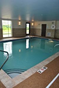 a large swimming pool in a building at Holiday Inn Express Salem, an IHG Hotel in Salem