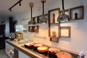 a kitchen with some pots and pans on a counter at Holiday Inn Wolverhampton - Racecourse by IHG in Wolverhampton