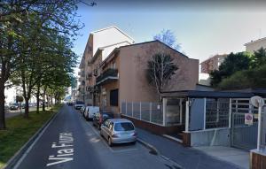 a car parked in a parking lot next to a building at Milan center Luxury House in Sesto San Giovanni