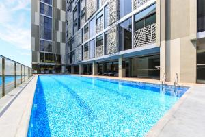 a swimming pool in the middle of a building at SILA Urban Living in Ho Chi Minh City +66 photos