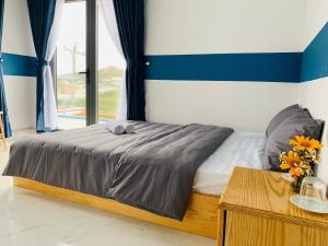 Postel nebo postele na pokoji v ubytování November Villa Đà Lạt