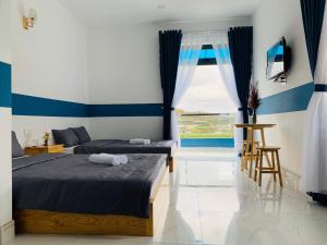 Postel nebo postele na pokoji v ubytování November Villa Đà Lạt