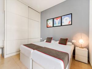 Llit o llits en una habitació de OYO Style Apartments Puerto